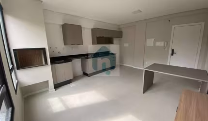 Apartamento à venda com 1 quarto, 1 vaga em Pedra Branca, Palhoça. Imóvel oferece sala de estar aconchegante, churrasqueira a carvão e área total de 53, 52 m² - AP1252