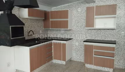 Casa terrea  a venda  sendo 3 quartos , 4 vagas de garagem , quintal .