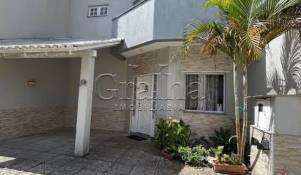 Casa em condomínio fechado com 3 quartos à venda na Rua Deputado Hugo Mardini, 1780, Passo das Pedras, Porto Alegre por R$ 699.000