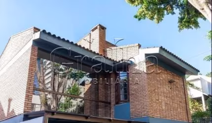 Casa com 3 quartos à venda na Avenida América, 268, Auxiliadora, Porto Alegre por R$ 1.490.000