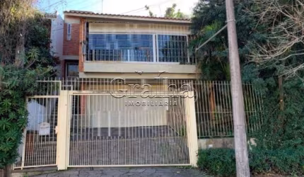 Casa com 4 quartos à venda na Rua Antônio Ribeiro, 321, Santo Antônio, Porto Alegre por R$ 600.000