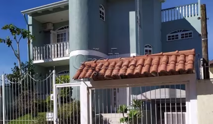 Casa com 3 quartos à venda na Rua Graciano Azambuja, 341, Partenon, Porto Alegre por R$ 1.150.000