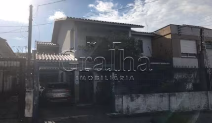 Casa com 5 quartos à venda na Rua Coronel Jaime da Costa Pereira, 318, Partenon, Porto Alegre por R$ 950.000