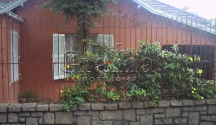 Casa com 4 quartos à venda na Rua Bernardino Caetano Fraga, 57, Santa Tereza, Porto Alegre por R$ 400.000