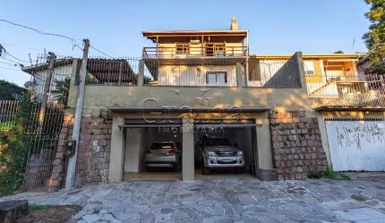 Casa em condomínio fechado com 3 quartos à venda na Acesso dos Hibiscos, 42, Santa Tereza, Porto Alegre por R$ 690.000