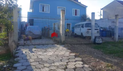 Sobrado em terreno com duas frentes