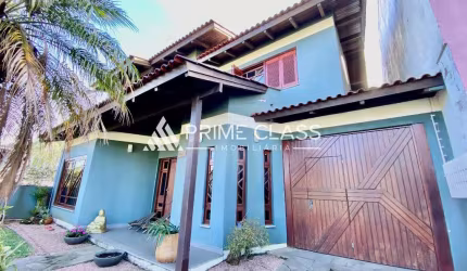 Casa com 4 quartos à venda na Rua Tenente Antônio João, 228, Loteamento Bela Vista, Canoas por R$ 1.350.000