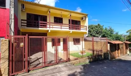 Casa 4 dormitórios à venda Vila Nova Porto Alegre/RS
