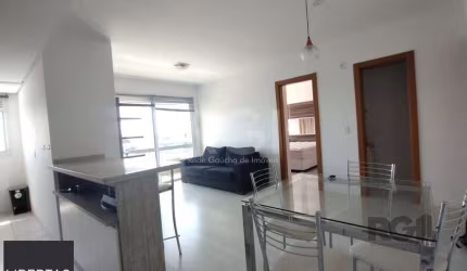 Apartamento mobiliado, 57m2, 1 suite, 1 vaga, lareira e churrasqueira, localizad