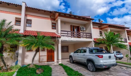 Casa em condomínio fechado com 3 quartos à venda na Avenida da Cavalhada, 4551, Cavalhada, Porto Alegre por R$ 840.000