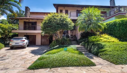 Casa em condomínio fechado com 5 quartos à venda na Avenida Firmino Octávio Bimbi, 255, Cavalhada, Porto Alegre por R$ 2.488.000