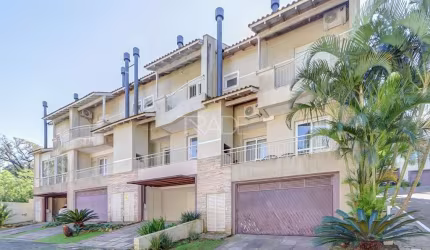 Casa em condomínio fechado com 3 quartos à venda na Avenida Coronel Marcos, 39, Pedra Redonda, Porto Alegre por R$ 980.000