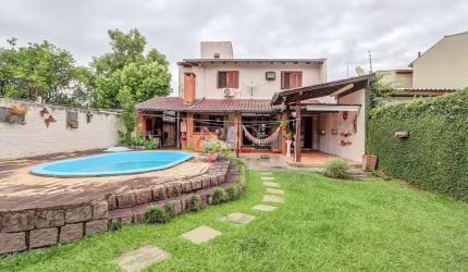 Casa com 3 quartos à venda na Avenida Guarujá, 140, Guarujá, Porto Alegre por R$ 750.000