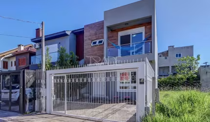 Casa com 3 quartos à venda na Rua Aldo Sani, 143, Hípica, Porto Alegre por R$ 700.000
