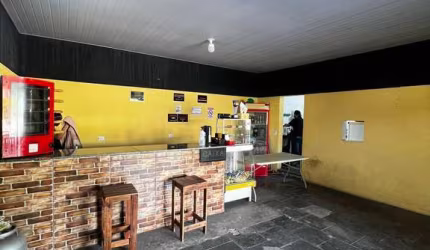 Salão comercial em Terra Preta com casa nos fundos à venda
