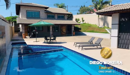 Casa á venda em Terra Preta com 3 dormitórios, suíte com hidromassagem.
