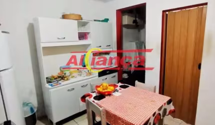 Investimento Garantido: Terreno com 3 Casas em Guarulhos!