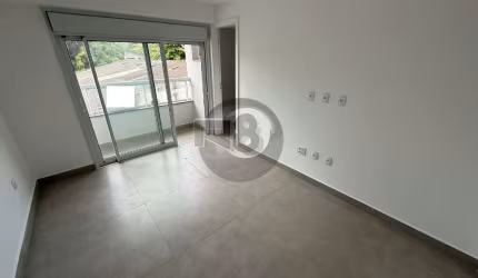 Apto NOVO centro  2 suítes, 2  vagas. Ensolarado!