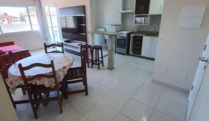 APARTAMENTO COM VARANDA GOURMET E VISTA PANORÂMICA NA PRAIA GRANDE.