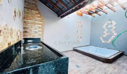 Casa com 3 dormitórios à venda, 115 m² por R$ 830.000,00 - Caiçara - Praia Grande/SP