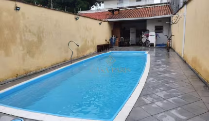 Casa com 4 dormitórios à venda, 220 m² por R$ 1.400.000,00 - Vila Guilhermina - Praia Grande/SP