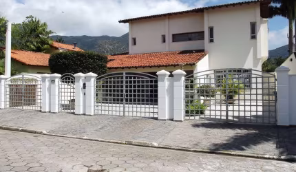 Casa com 3 dormitórios, 420 m² - venda por R$ 1.800.000,00 ou aluguel por R$ 7.000,00/mês - Arrastão - São Sebastião/SP