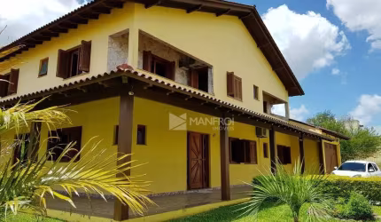 Casa com 5 dormitórios à venda, 509 m² por R$ 1.699.990,00 - Parque Santa Fé - Porto Alegre/RS