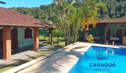 Casa de 4 dormitórios, mais um reversível, com 300m² e 720m² de terreno no Residencial VerdeMar, Massaguaçu, Caraguatatuba - SP