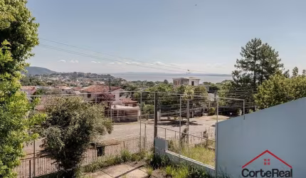 Casa com 3 quartos à venda na Avenida Leonardo Carlucci, 140, Espírito Santo, Porto Alegre por R$ 550.000