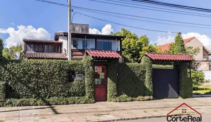 Casa com 3 quartos à venda na Avenida Guarujá, 140, Guarujá, Porto Alegre por R$ 749.000