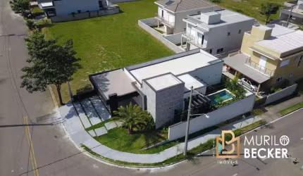 Casa com 3 suítes e piscina no Condomínio Terras do Vale