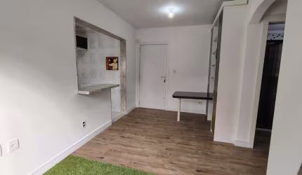 Apartamento de 1 dormitório, living, cozinha planejada, banheiro social.