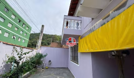 Sobrado com 3 dormitórios à venda, 120 m² por R$ 400.000 - Vila São Paulo - Mongaguá/SP
