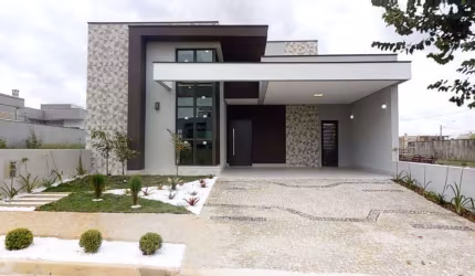 Casa Térrea 3 Suítes, área gourmet com churrasqueira a carvão, piscina, banheiro externo, área de serviço, despensa, 4 vagas (2 cobertas), Lote 275m2