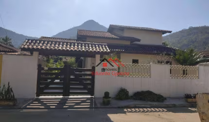 Sobrado com 4 dormitórios à venda, 300 m² por R$ 1.200.000,00 - Condomínio Verde Mar - Caraguatatuba/SP