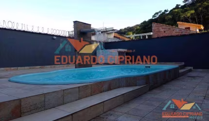 Casa com 3 dormitórios à venda, 111 m² por R$ 690.000,00 - Massaguaçu - Caraguatatuba/SP