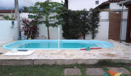 Casa com 3 dormitórios para alugar por R$ 4.095,46/mês - Massaguaçu - Caraguatatuba/SP
