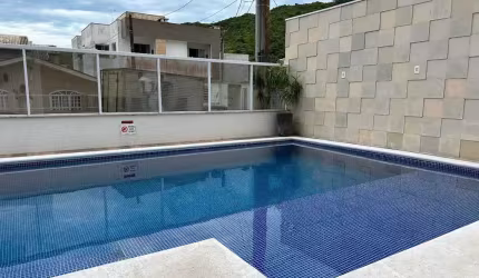 Apartamento mobiliado com 2 suítes e 2 vagas de garagem no bairro Ressacada