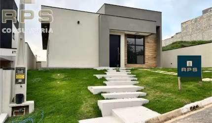 Casa térrea em condomínio com 4 dormitórios, sendo 2 suítes, cozinha gourmet, piscina aquecida e sala com pé direito alto