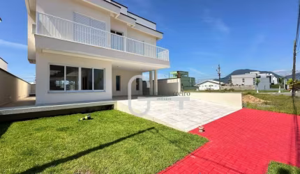 Casa com 4 dormitórios à venda, 255 m² por R$ 1.680.000,00 - Condomínio Flora Rica - Peruíbe/SP