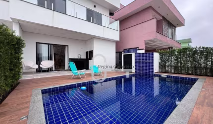 Casa com 4 dormitórios à venda, 207 m² por R$ 1.450.000,00 - Condomínio Flora Rica - Peruíbe/SP