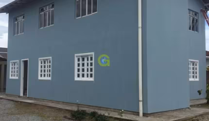 Casa comercial a venda bairro Ponte do Imaruim, em Palhoça, conta com 4 apartame