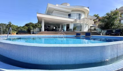 Casa em condomínio fechado, com 4 suítes, com vista mar, no Bosque das Mansões.