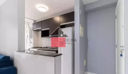 Apartamento de 60 m² com dois dormitórios, varanda, cozinha planejada, área de serviço e garagem co