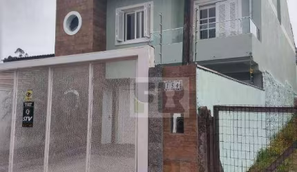 Ótimo sobrado com 3 dormitórios sendo 2 suítes á venda no bairro Moradas do Bosque em Cachoeirinha RS.
