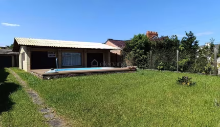 Casa em condomínio fechado com 3 quartos à venda na Rua Guara, 627, Atlântida, Xangri-Lá por R$ 1.000.000