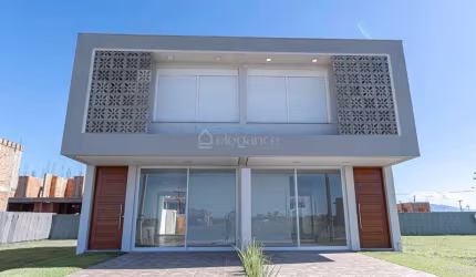 Casa em condomínio fechado com 3 quartos à venda na Rs 389, Estrada do Mar, 27, Santorini, Xangri-Lá por R$ 750.000
