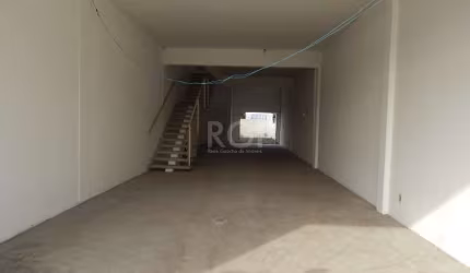 Excelente loja de calçada na Av Carlos Barbosa com 277,08  m² de área privativa , frente envidraçada, estacionamento em frente , boa movimentação de veículos , nunca utilizada.&lt;BR&gt;&lt;BR&gt;&lt;
