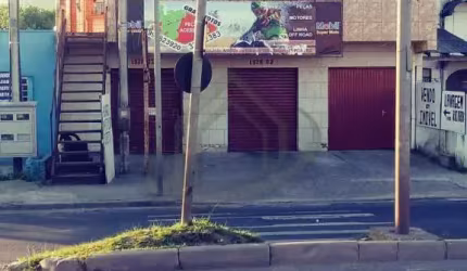 Ótimo prédio comercial e residencial em uma das principais ruas da Restinga, no terreno de mais de 500m² de área útil possui 2 JK residenciais, 2 lojas e uma casa com 3 dormitórios, 2 banheiros, 2 sal