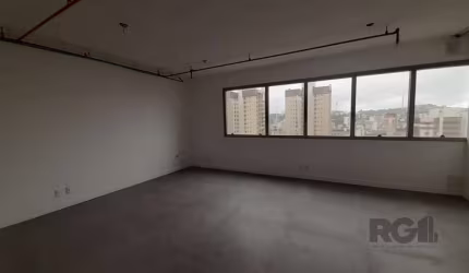 Excelente sala comercial no Menino Deus, com uma vaga de garagem.